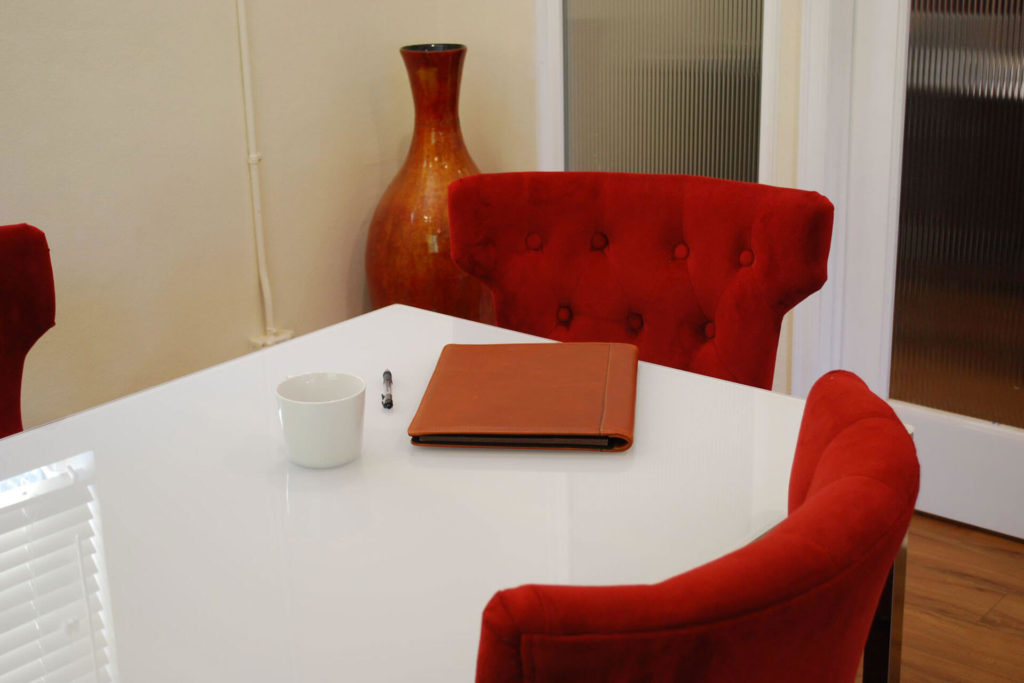 Table and chair with notebook and coffee cup